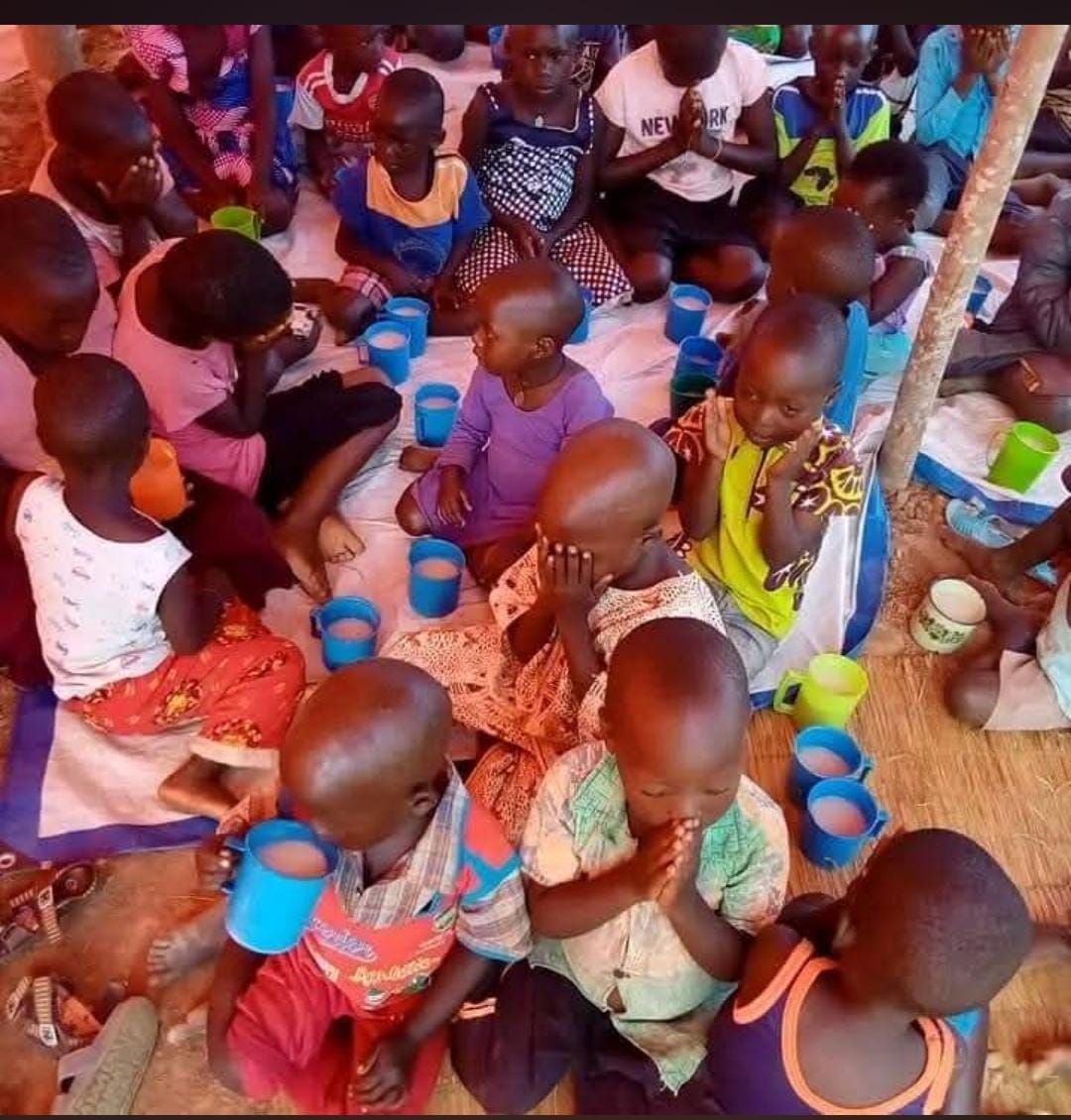Children receiving meals from Charity Mission